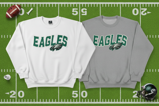 Eagles sweatshirts on football background